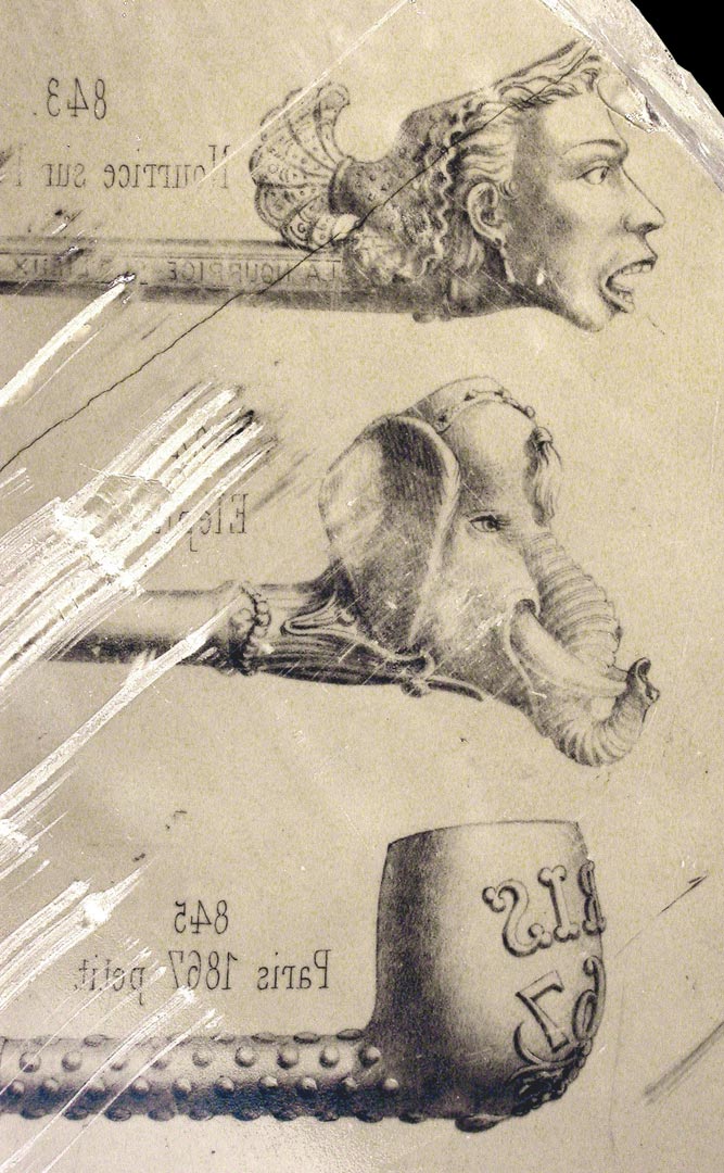 Fragment de pierre lithographique d&eacute;couvert dans les m&ecirc;mes circonstances et servant de matrice &agrave; l'impression d�un catalogue pour la vente de la production de cet atelier de pipier.   &copy; D.Bossut, Inrap 